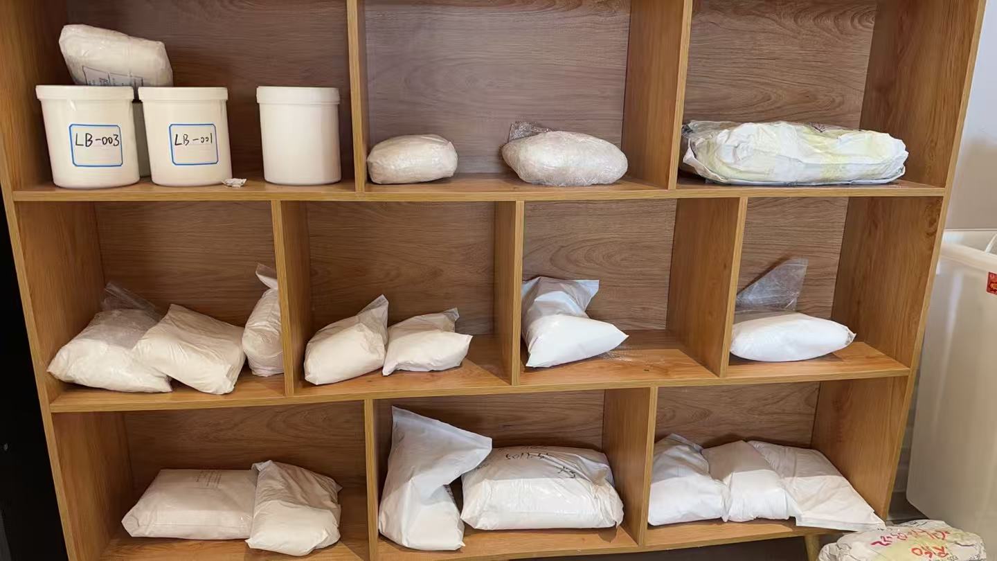 Bagged samples and containers on wooden shelves